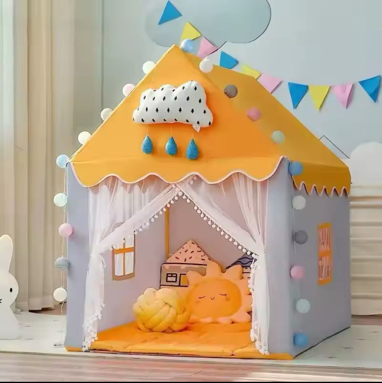 Casita de juego amarilla